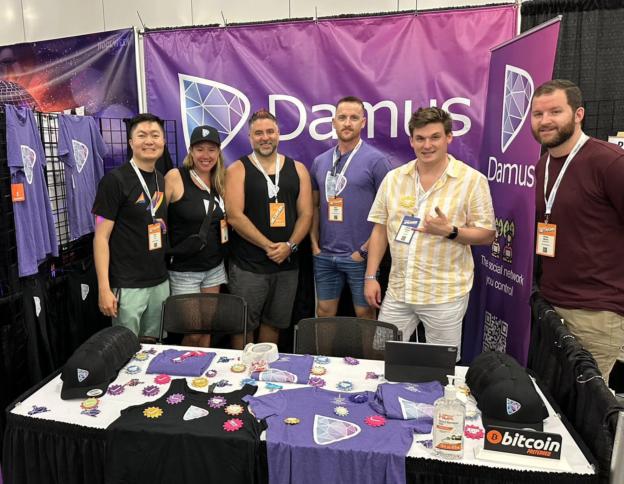 Members of the Damus team and friends at a conference booth